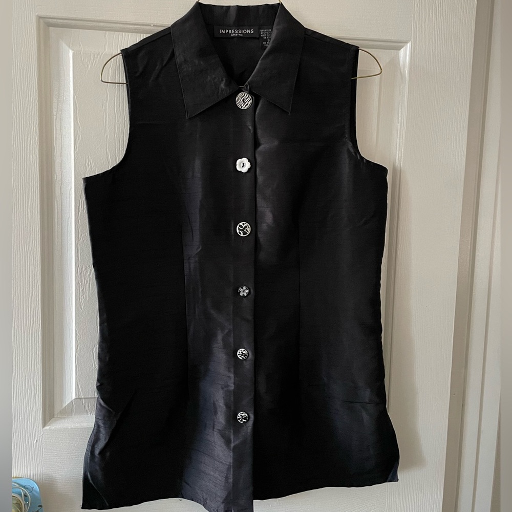 Black nylon poly dress vest.  With tie back and assorted front buttons.